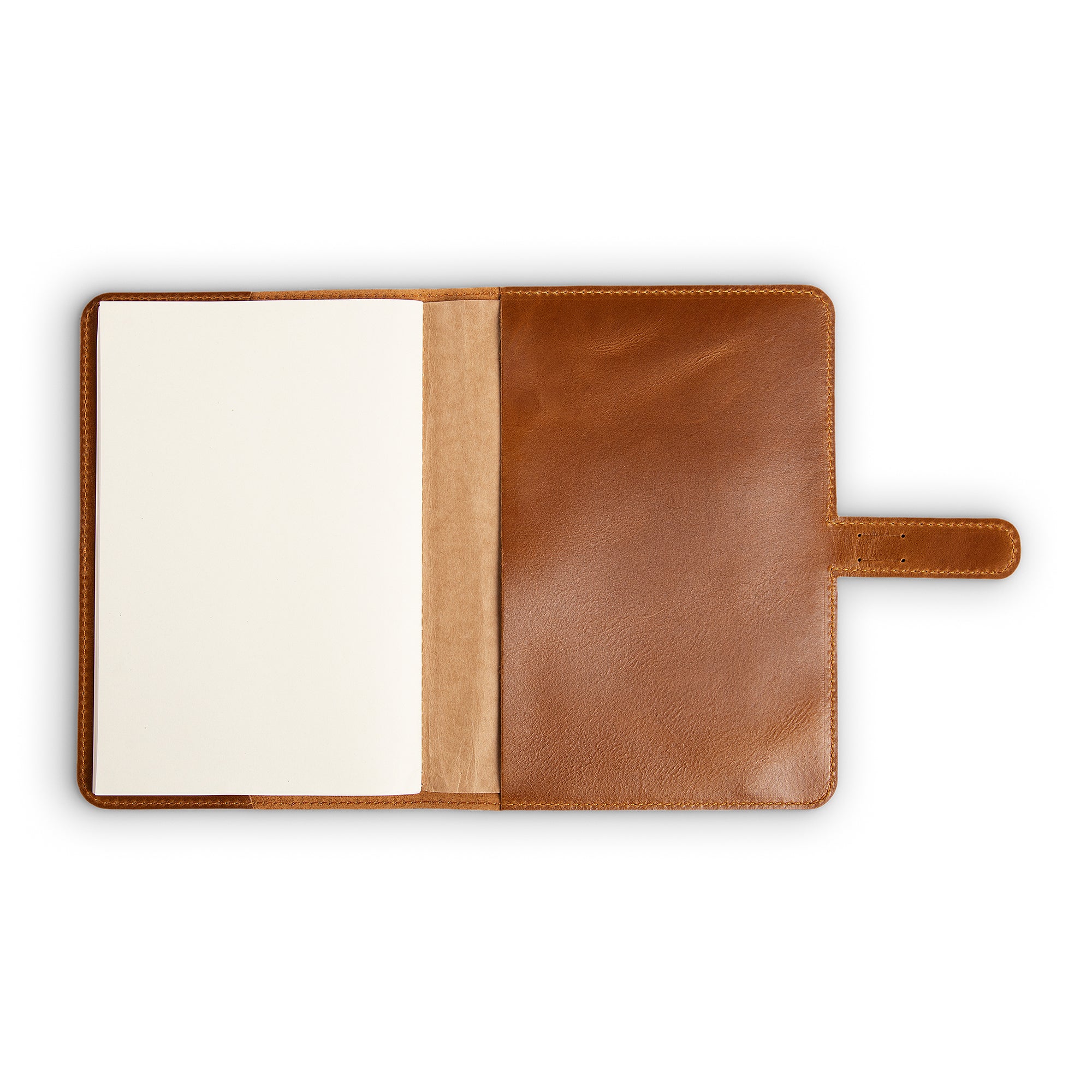 DuPage Mustard Brown journal open to show blank white paper refill on left, natural vachetta spine pocket at center, and warm tan Dexios pull-up leather interior on right with strap tab. 