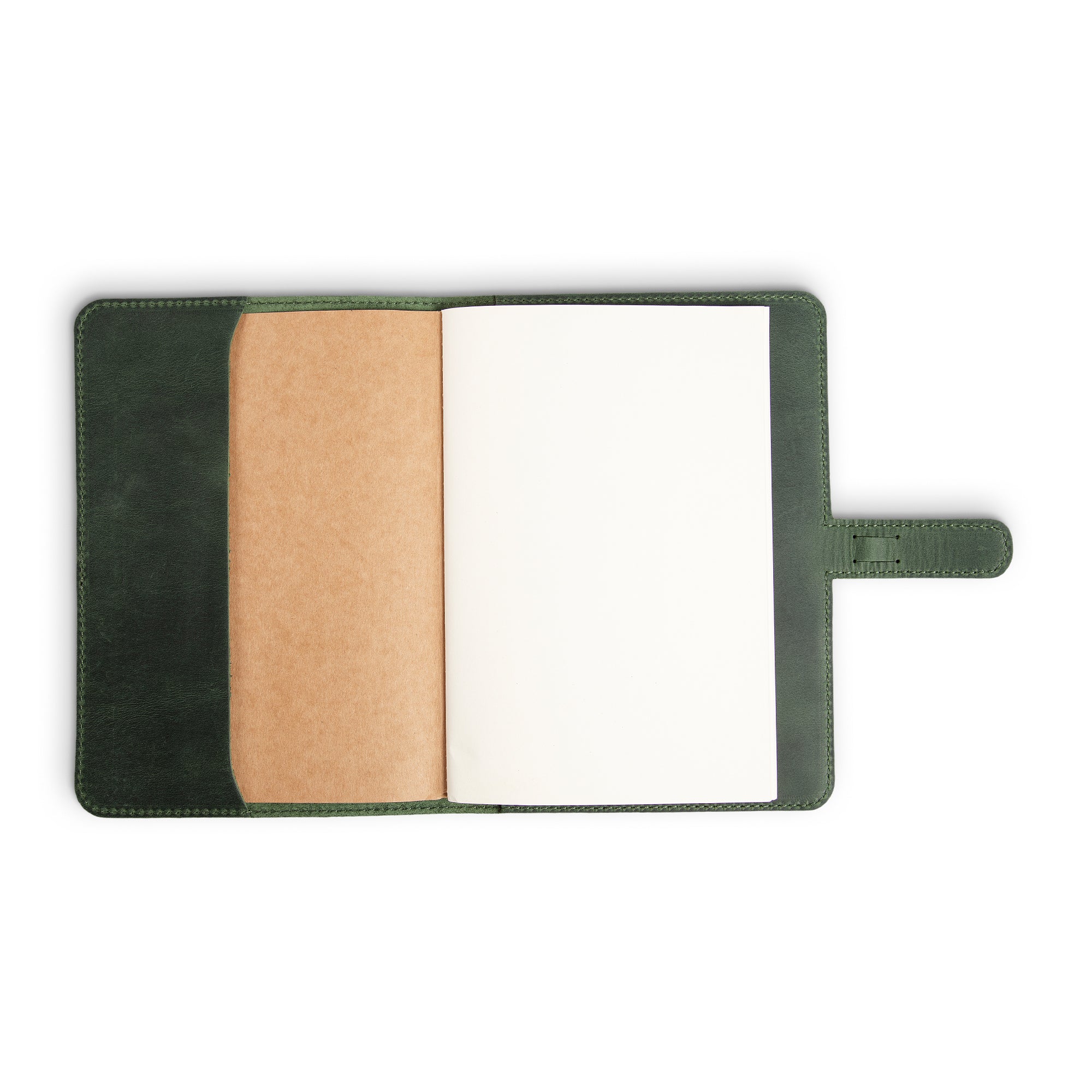 DuPage Green journal open to show blank white paper refill on right panel, natural vachetta spine pocket at center, and forest green pull-up leather interior, with strap tab visible.
