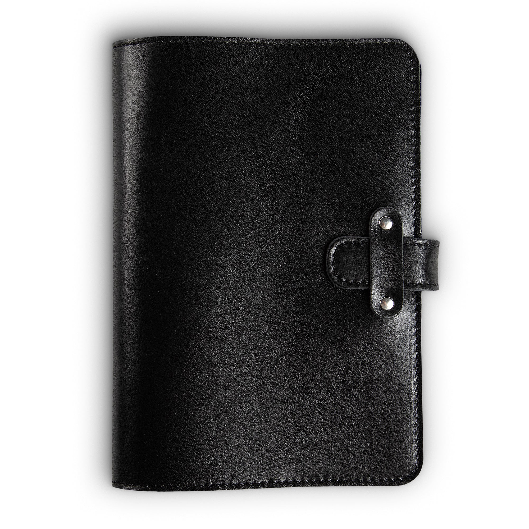 Black Dexios pull-up calfskin leather journal, front cover view, with black saddle stitching along edges and a leather strap closure secured by two silver-tone rivets on the right side.