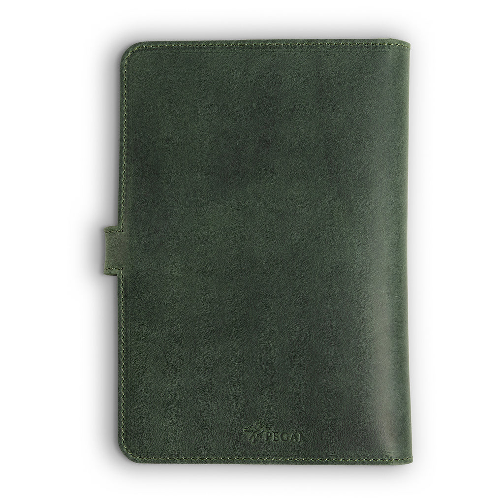 Back cover of forest green DuPage Dallas Crazy Horse leather journal showing smooth waxy pull-up surface, green perimeter stitching, side strap tab, and embossed PEGAI logo at bottom center. 