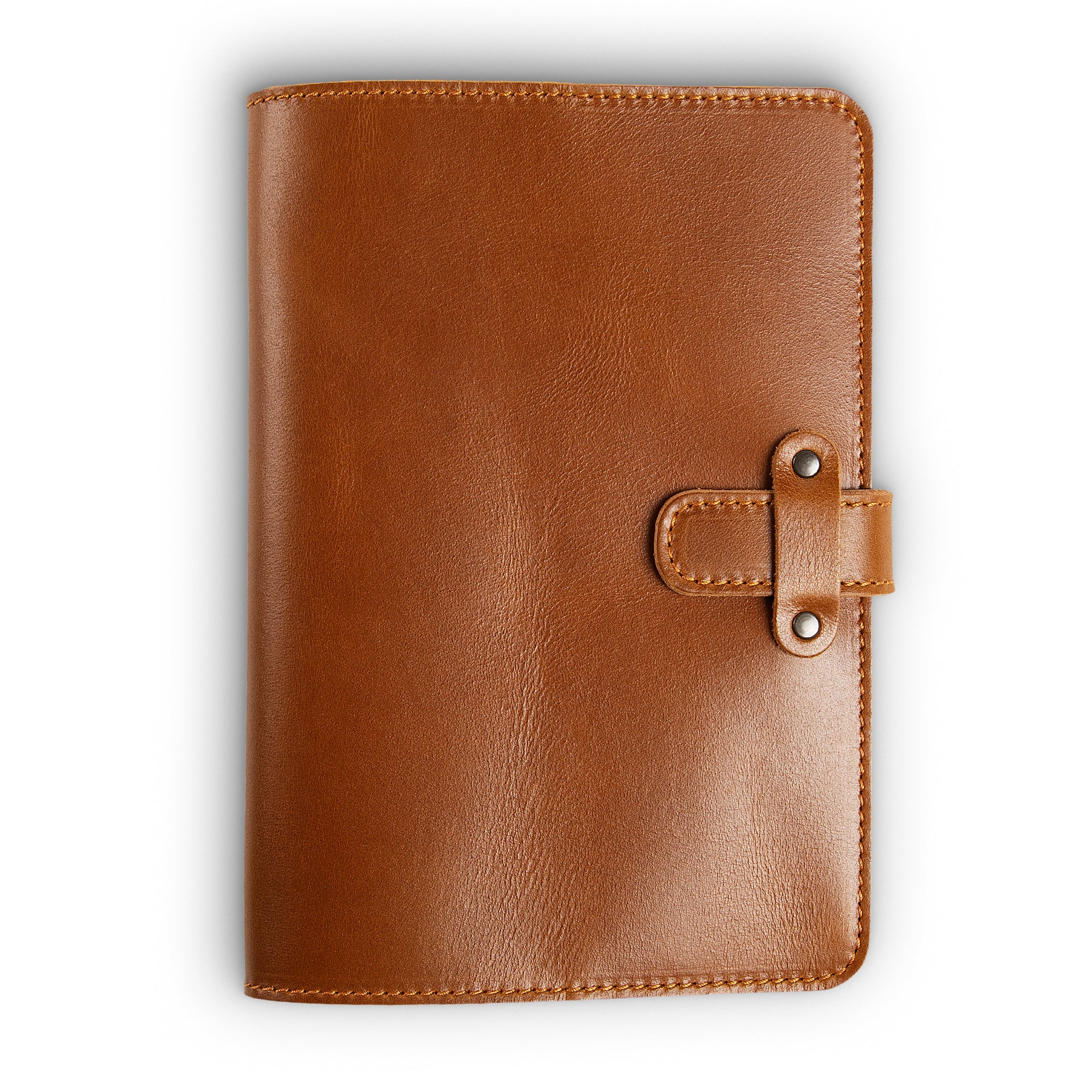 Mustard brown Dexios pull-up calfskin leather journal, front cover view, showing warm honey-tan smooth surface with subtle natural variation, orange saddle stitching, and antique brass rivet strap closure.