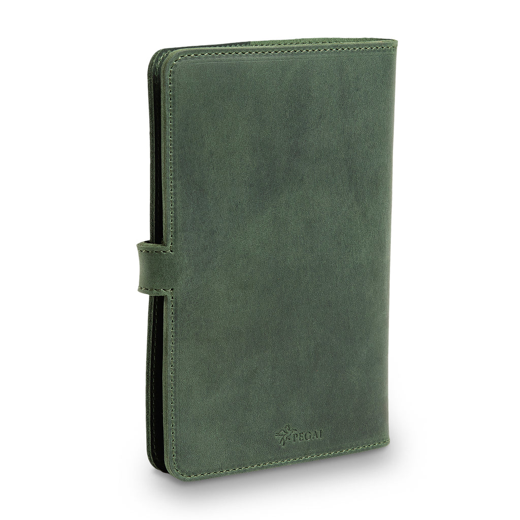 Three-quarter front view of closed green DuPage journal showing spine thickness, green saddle stitching, side strap closure tab, and embossed PEGAI logo on lower front cover. 