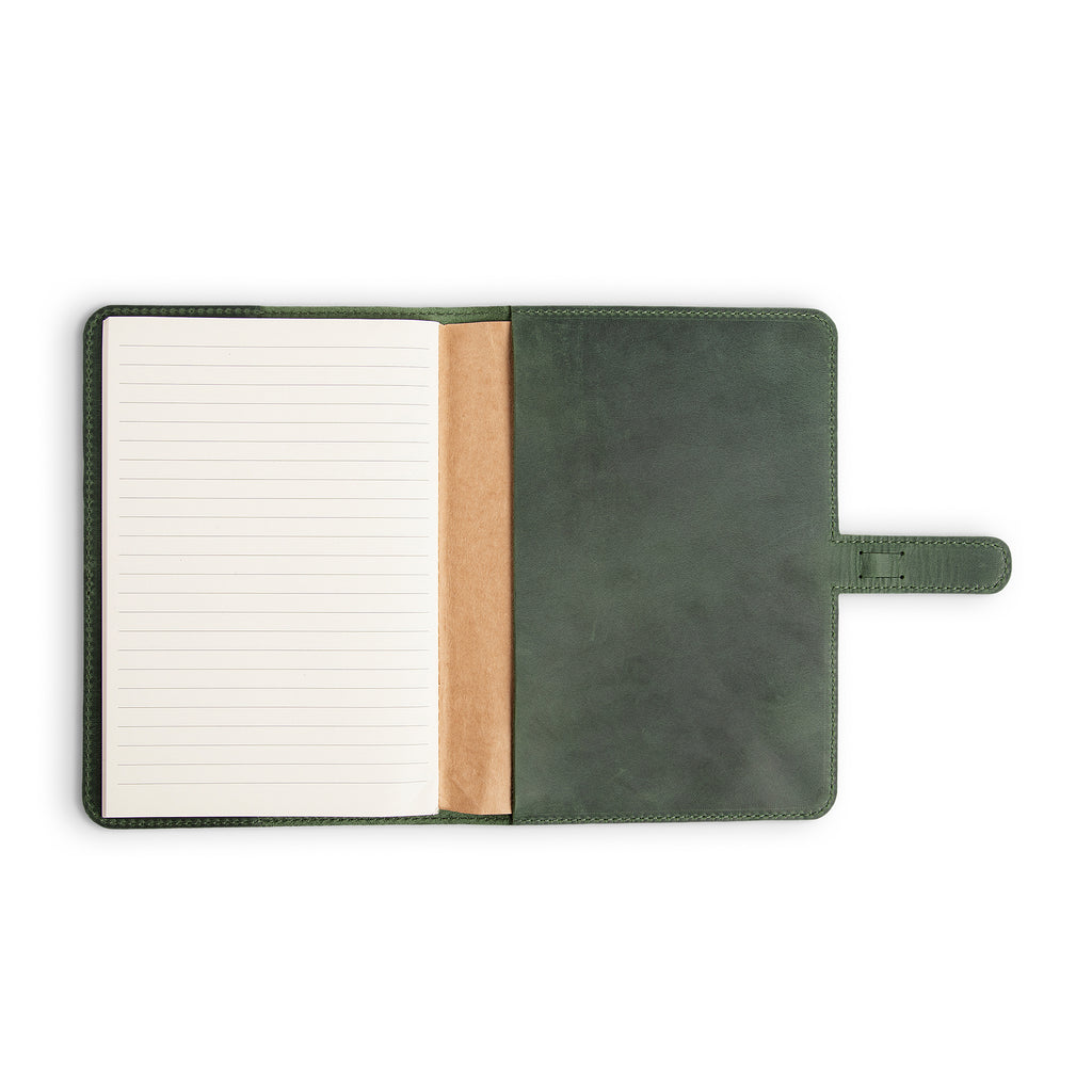 DuPage Green journal open to show lined paper refill on left, natural vachetta leather slip pocket at center, and forest green Dallas Crazy Horse pull-up leather interior on right.