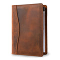 PEGAI Eriksen Jr. padfolio in mahogany Dallas Crazy Horse waxy pull-up leather, standing slightly open with a lined legal pad visible along the right edge.
