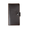 Clark Leather Checkbook Cover in Dual Tone Coffee, closed and laid flat on a white surface. DT Lux cowhide in a deep espresso coffee tone with a glossy pull-up finish that reveals lighter warm brown tonal variation where the leather bends and catches light. Warm tonal brown saddle stitching runs along all four edges. A small leather tab with an antique brass snap closure sits centered on the right edge.
