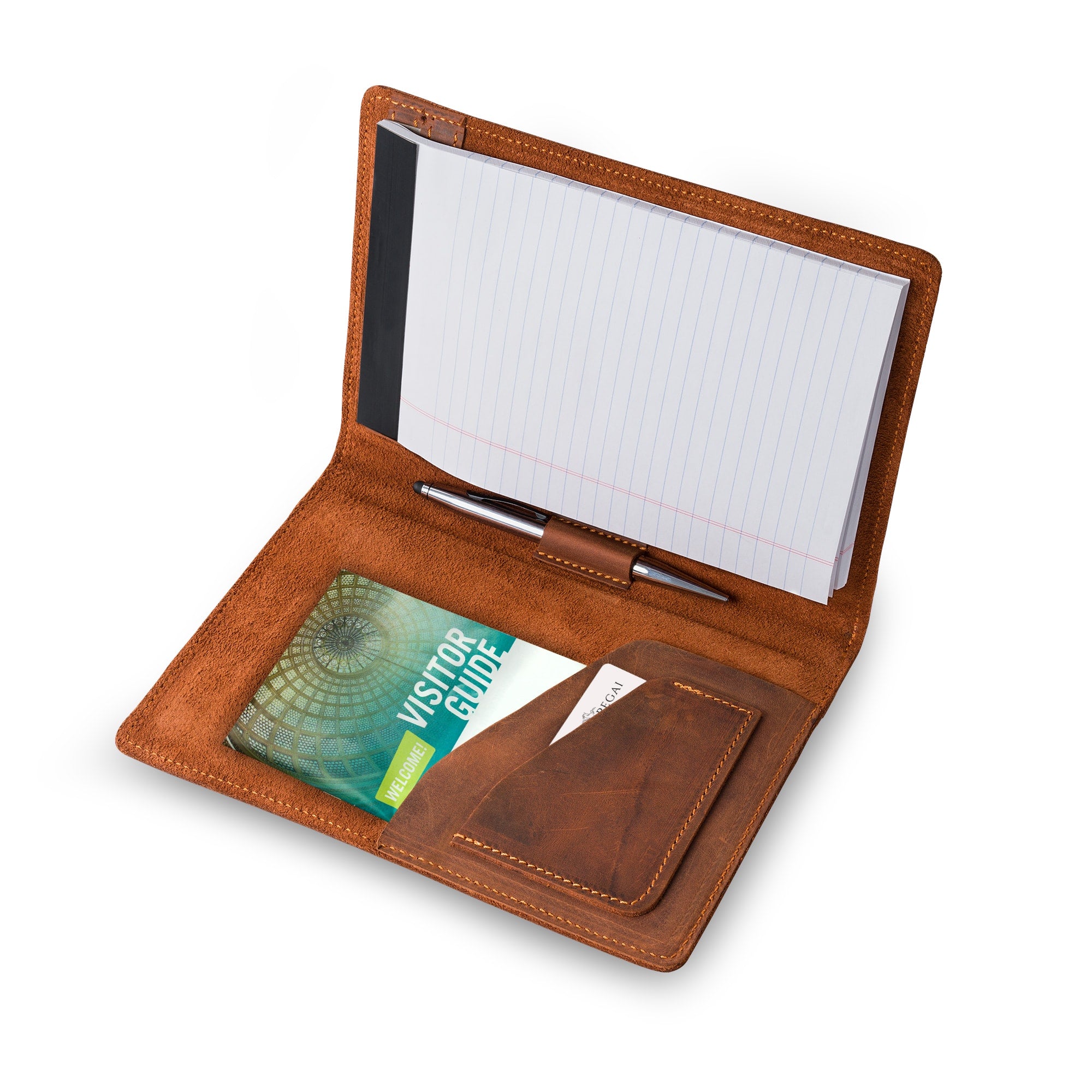 PEGAI Eriksen Jr. padfolio in mahogany Dallas Crazy Horse leather, open and in use with a lined legal pad, a pen in the center loop, and a visitor guide and cards in the left pocket.