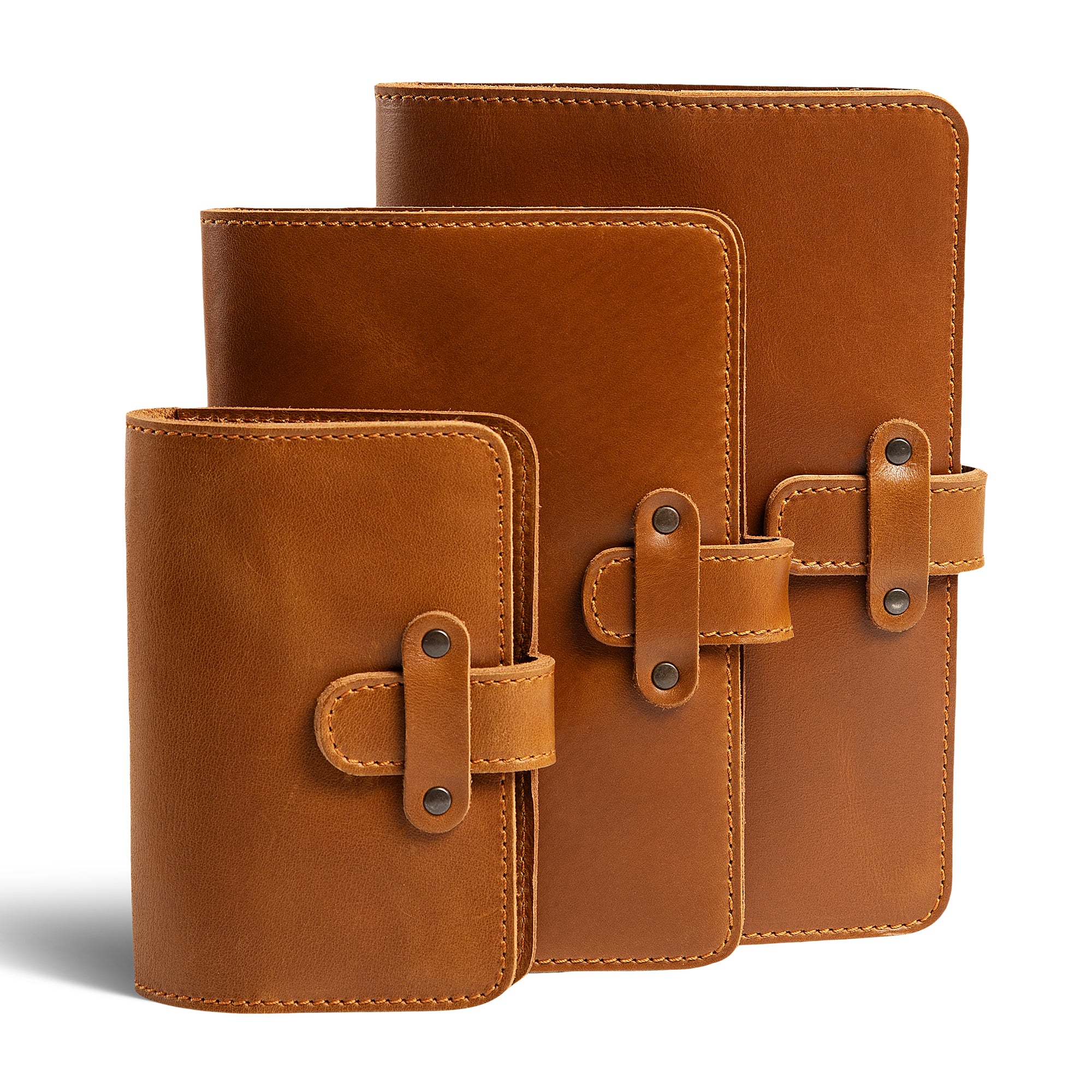 Three DuPage leather journals in mustard brown showing Pocket, Midi, and Full size comparison, all with matching orange saddle stitching, antique brass rivets, and smooth warm tan pull-up surfaces.