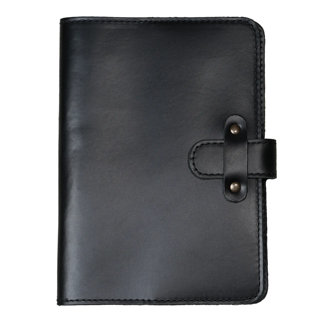 Dual Tone Black DT Lux cowhide leather journal, front cover view on white background, showing glossy pull-up surface with subtle tonal shift, black saddle stitching, and antique brass rivet strap closure.