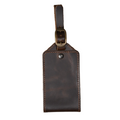 Brown DT Lux leather luggage tag with antique brass buckle and handcrafted pull-up leather finish
