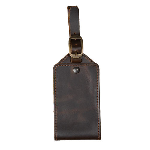 Brown DT Lux leather luggage tag with antique brass buckle and handcrafted pull-up leather finish