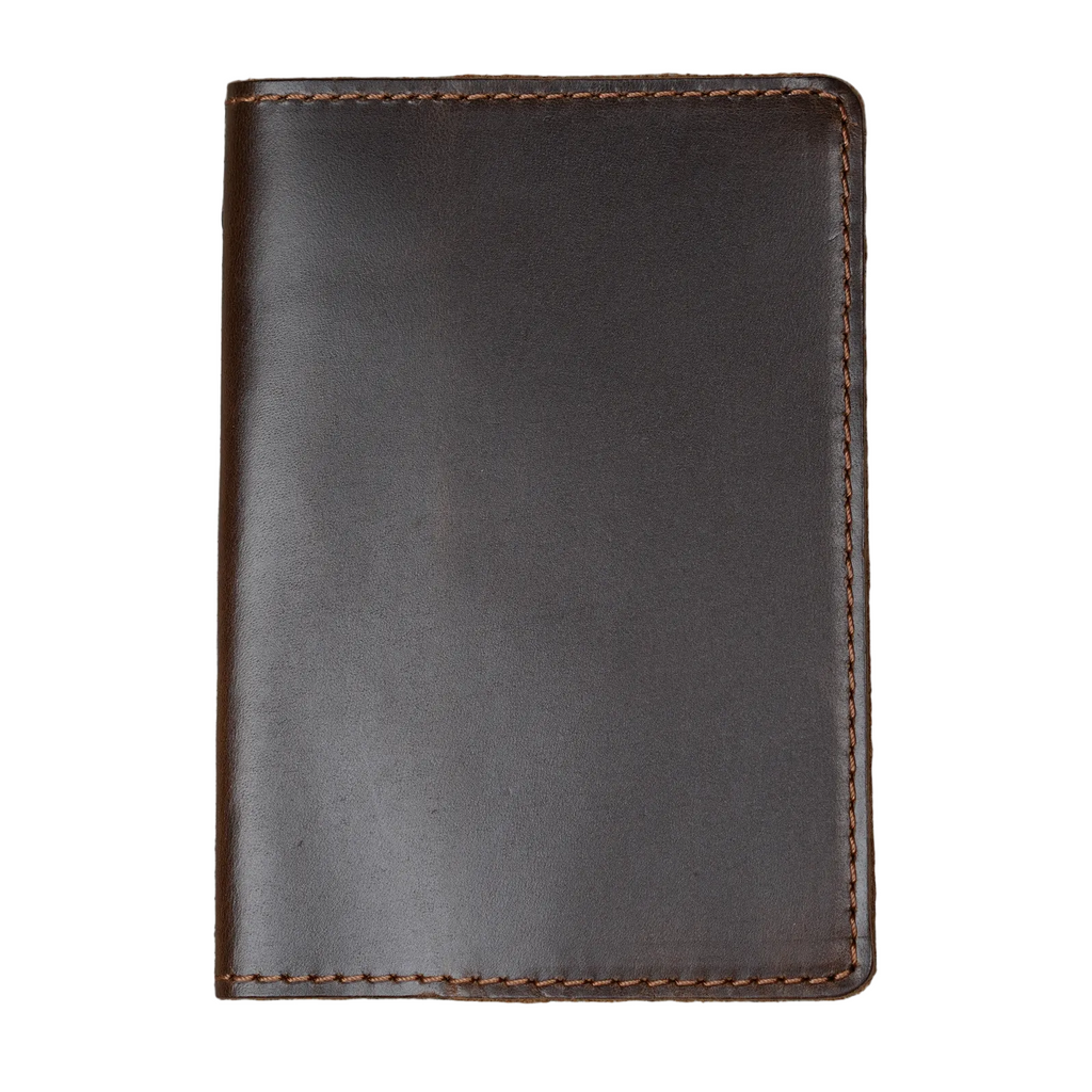 Dual tone coffee leather passport cover, closed and laid flat. Deep espresso brown glossy pull-up surface with warm tonal variation shifting from dark chocolate to rich brown. Hand-stitched edges in matching brown thread. Rounded corners and clean minimal silhouette.