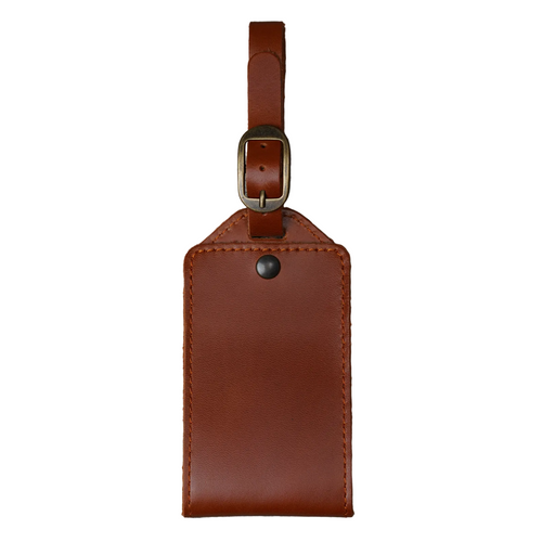 Tan DT Lux leather luggage tag with antique brass buckle and adjustable travel strap