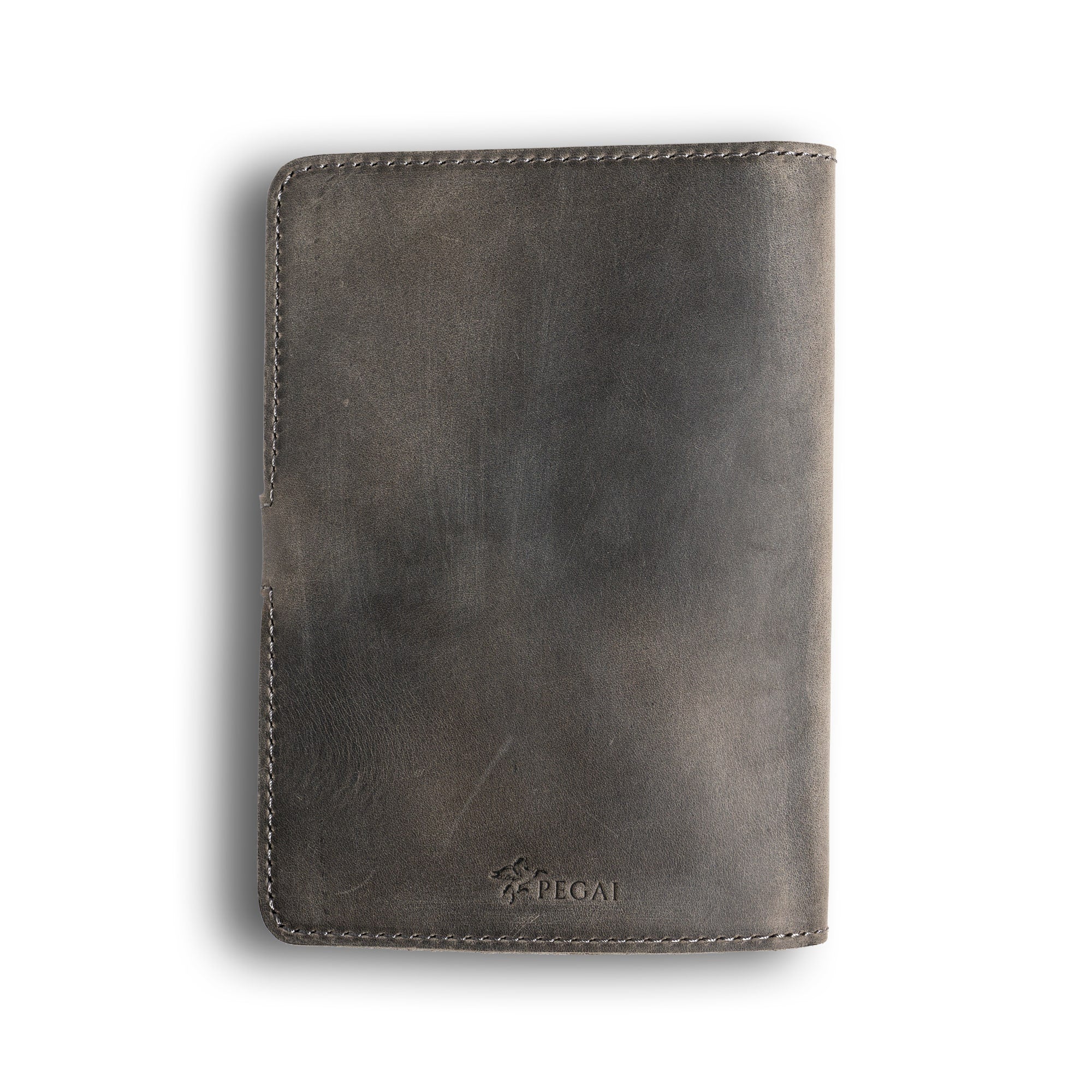Back cover of rock gray DuPage Dallas Crazy Horse leather journal showing distressed cool gray pull-up surface with deep tonal shift, gray perimeter stitching, side strap tab, and embossed PEGAI logo.