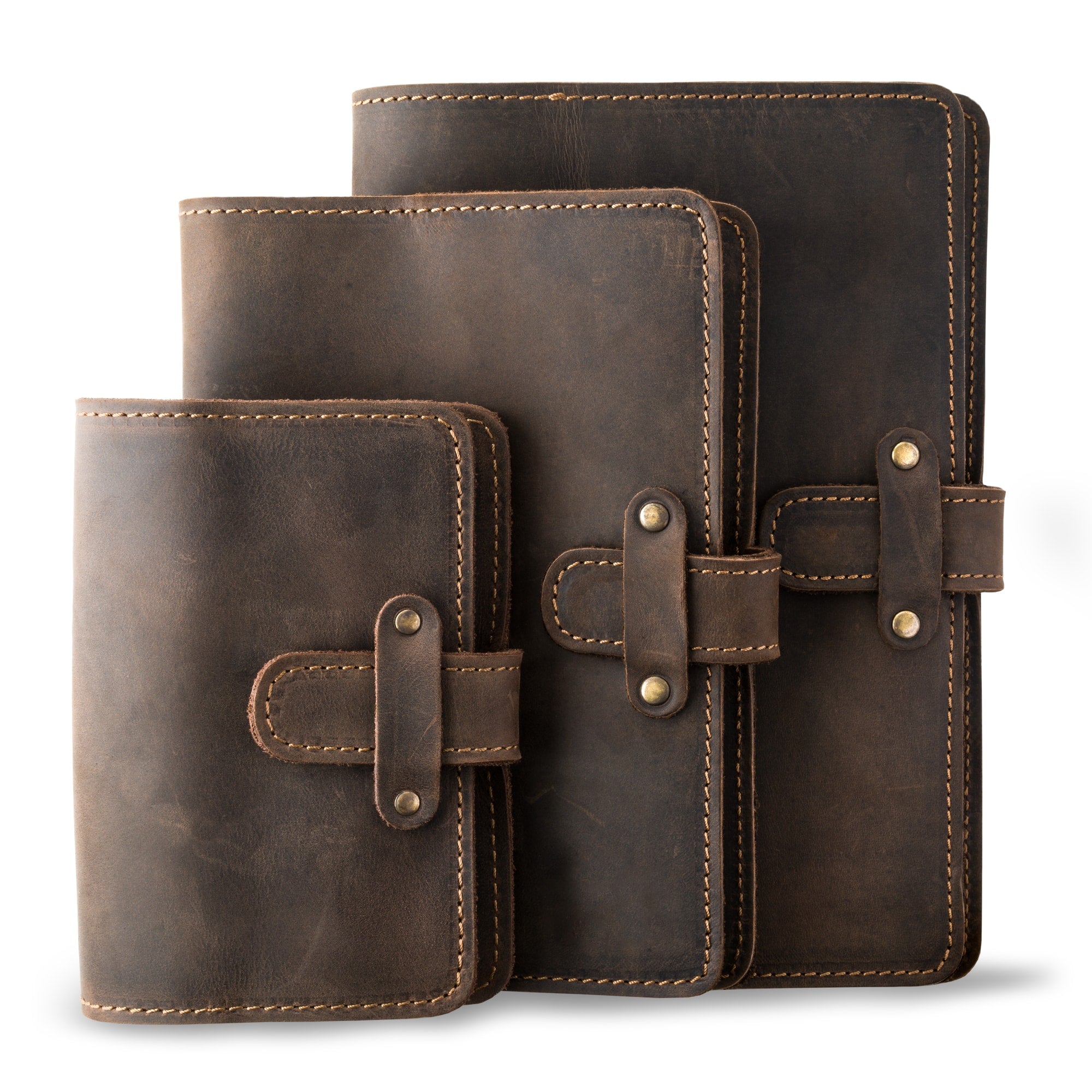 Three DuPage leather journals in chestnut brown showing Pocket, Midi, and Full size comparison, all with matching tan saddle stitching, antique brass rivets, and distressed pull-up surfaces.