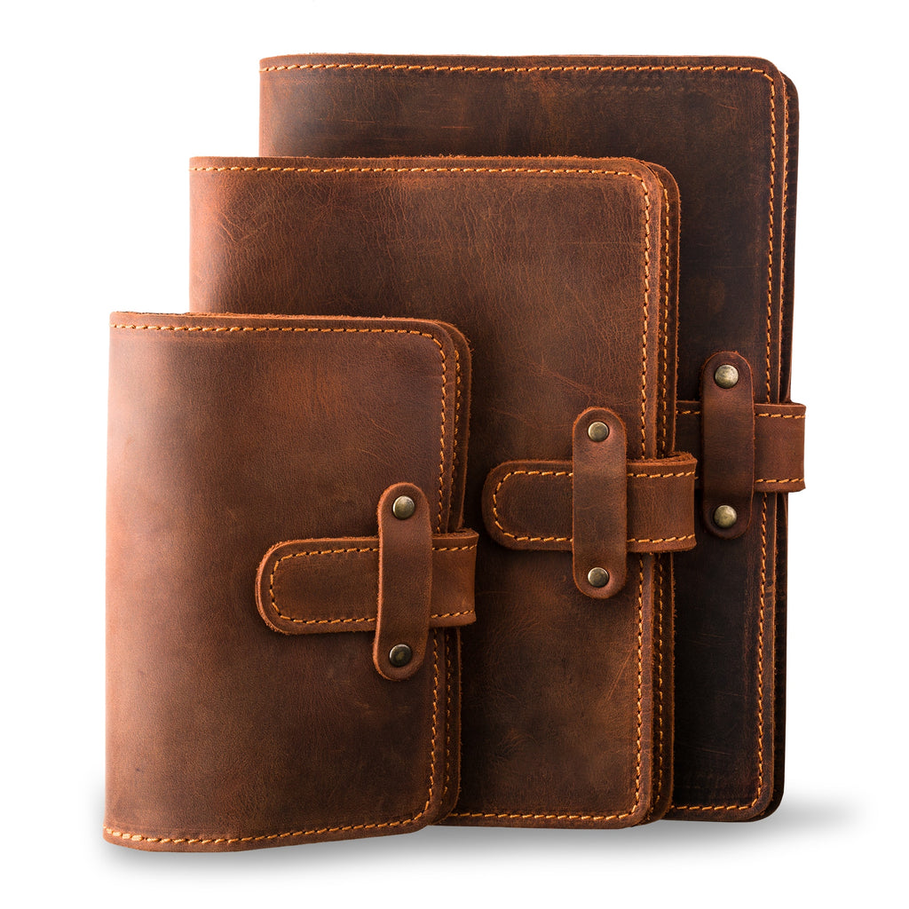 Three DuPage leather journals in mahogany showing Pocket, Midi, and Full size comparison, all with matching orange saddle stitching, antique brass rivets, and heavily distressed warm brown pull-up surfaces.