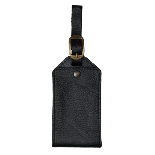 Black Dymnos full-grain leather luggage tag with antique brass buckle and textured pull-up finish