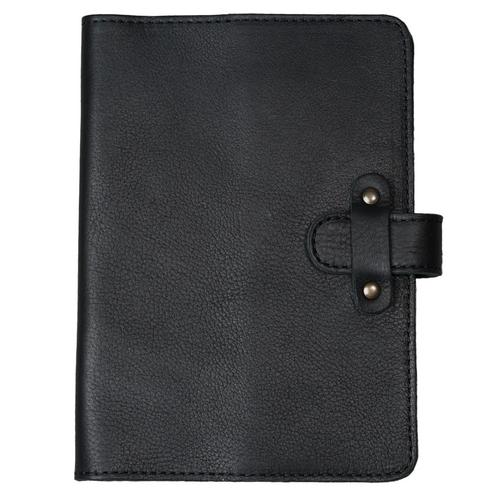 Dymnos Black full-grain calfskin leather journal, front cover on white background, showing pebbled pull-up surface with natural grain texture, black saddle stitching, and antique brass rivet strap closure.