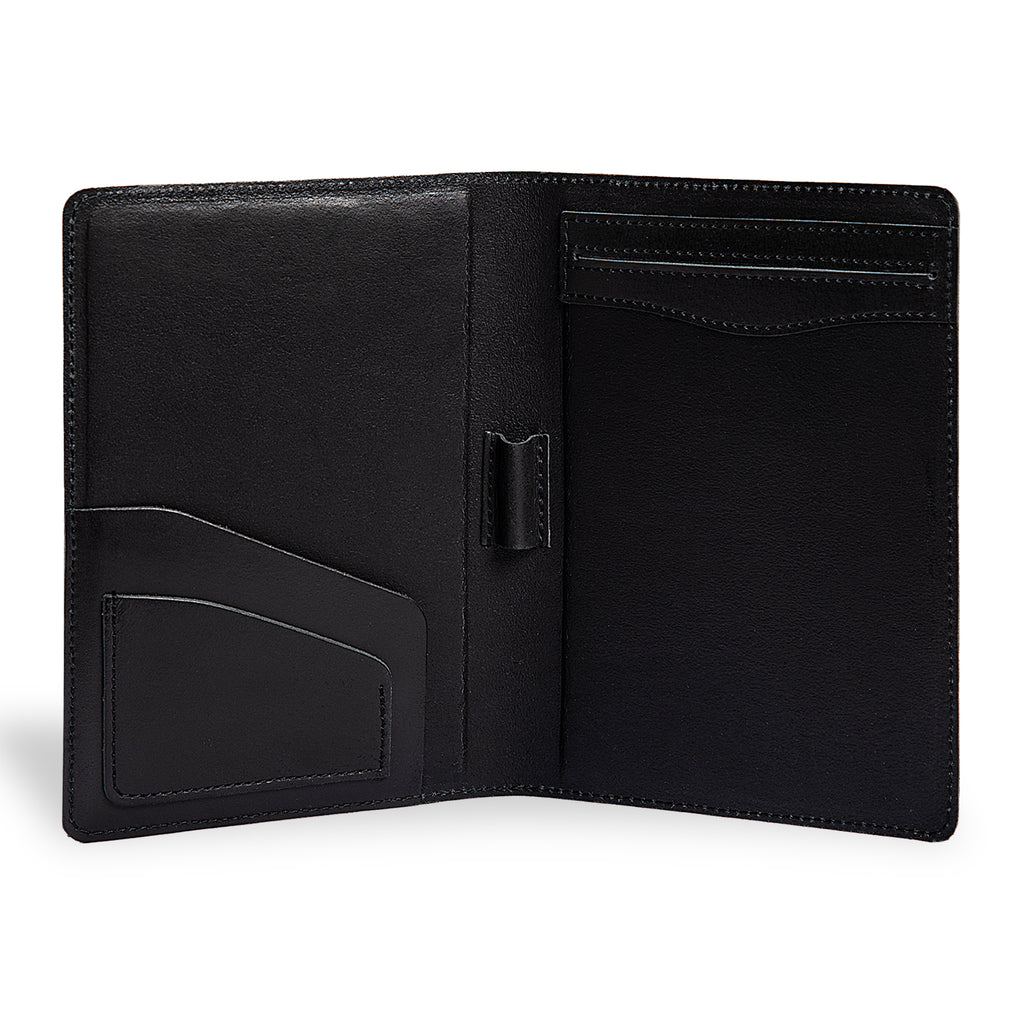 PEGAI Eriksen Jr. padfolio open and empty, showing left interior pocket, business card slot, and central pen loop on charcoal black Iphitos buffalo leather.