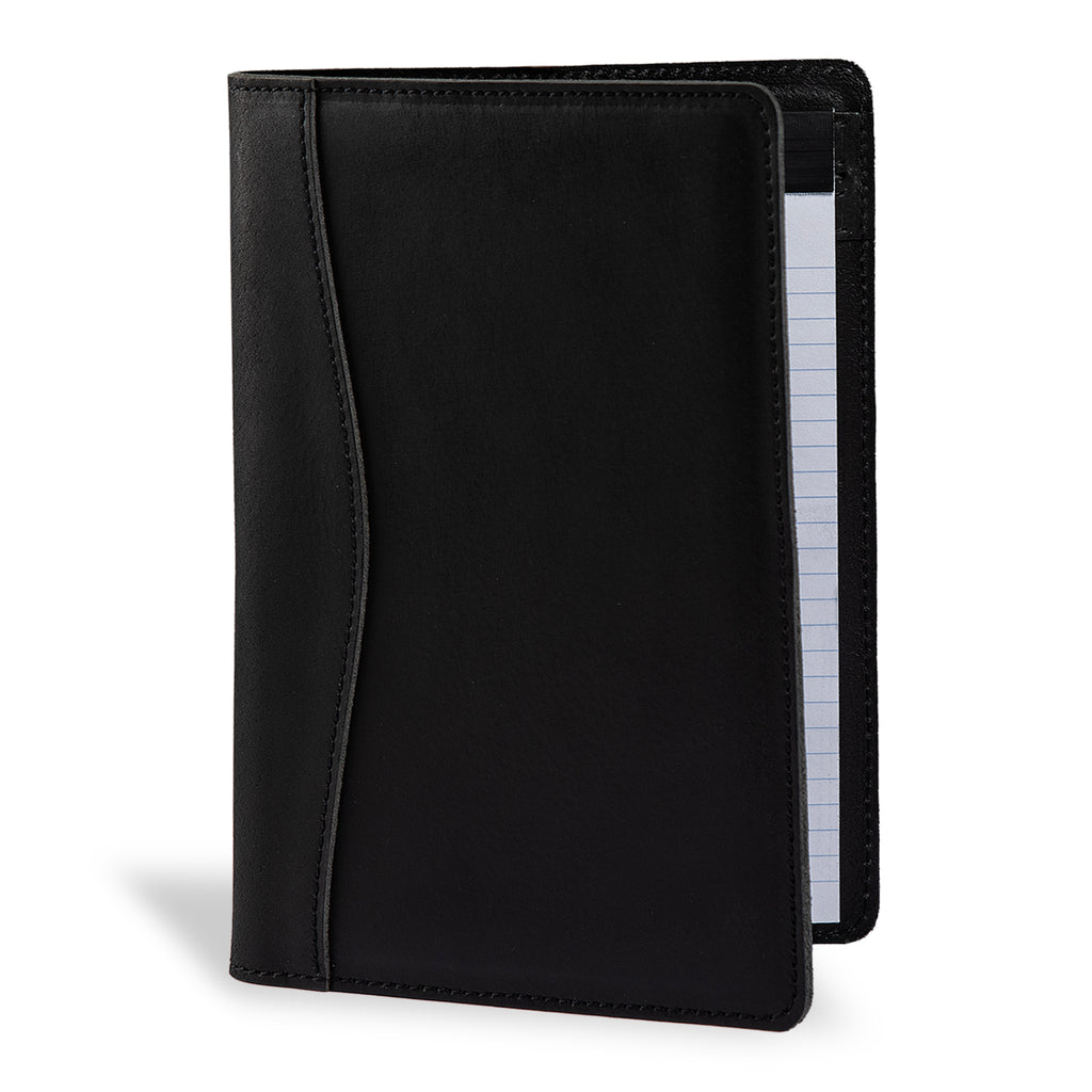 PEGAI Eriksen Jr. padfolio in charcoal black Iphitos buffalo leather, standing open at an angle with a lined legal pad visible along the right edge. 