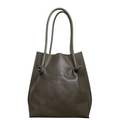 Flora Everyday Tote in Smooth Calf Green stands upright with a soft, fine-grain finish, dual rolled handles, and a single knotted leather closure on each side.