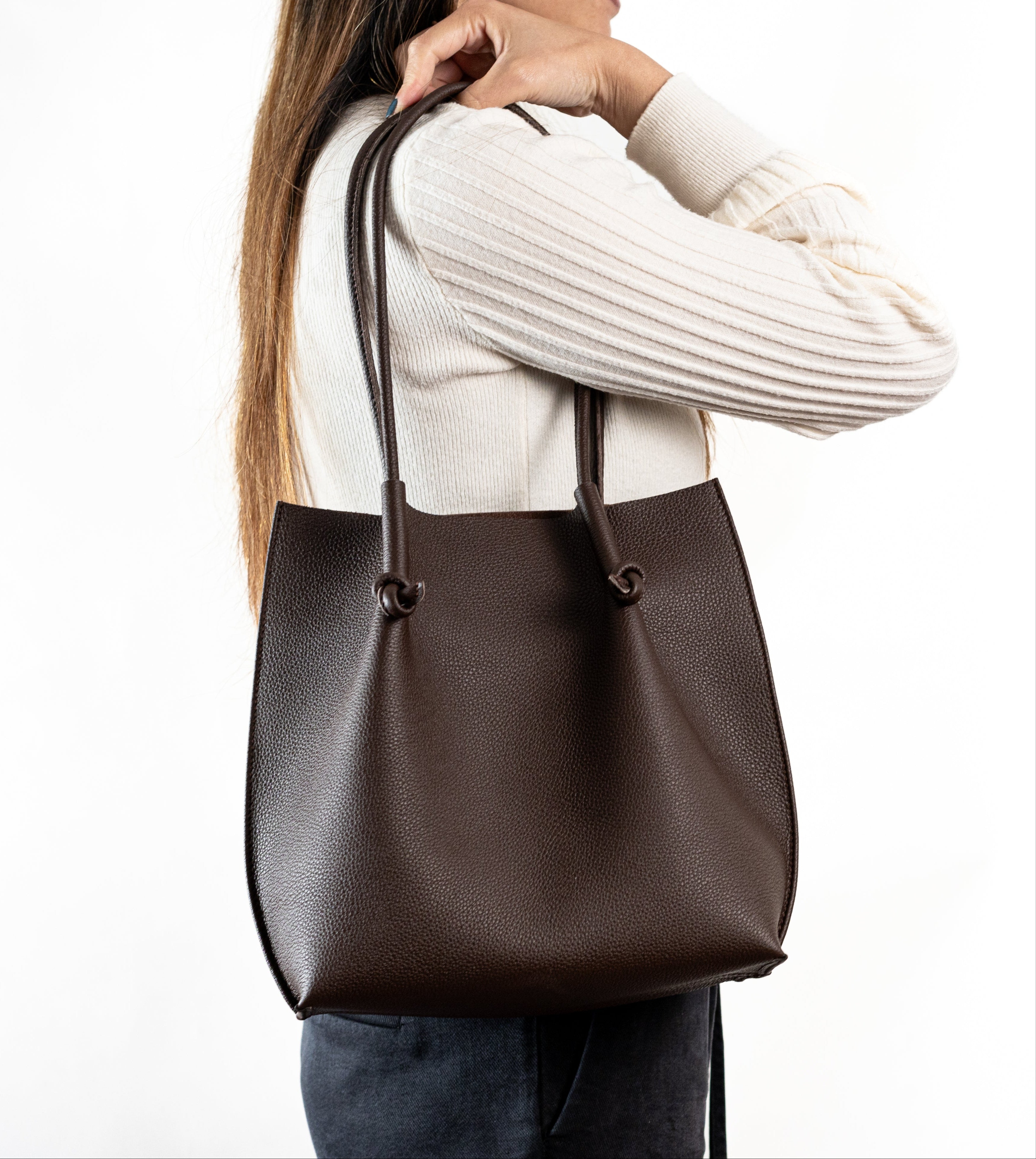Flora Everyday Leather Tote in Togo Calf Brown with raw suede interior, rolled handles, and folded edge details—crafted for timeless, daily use.