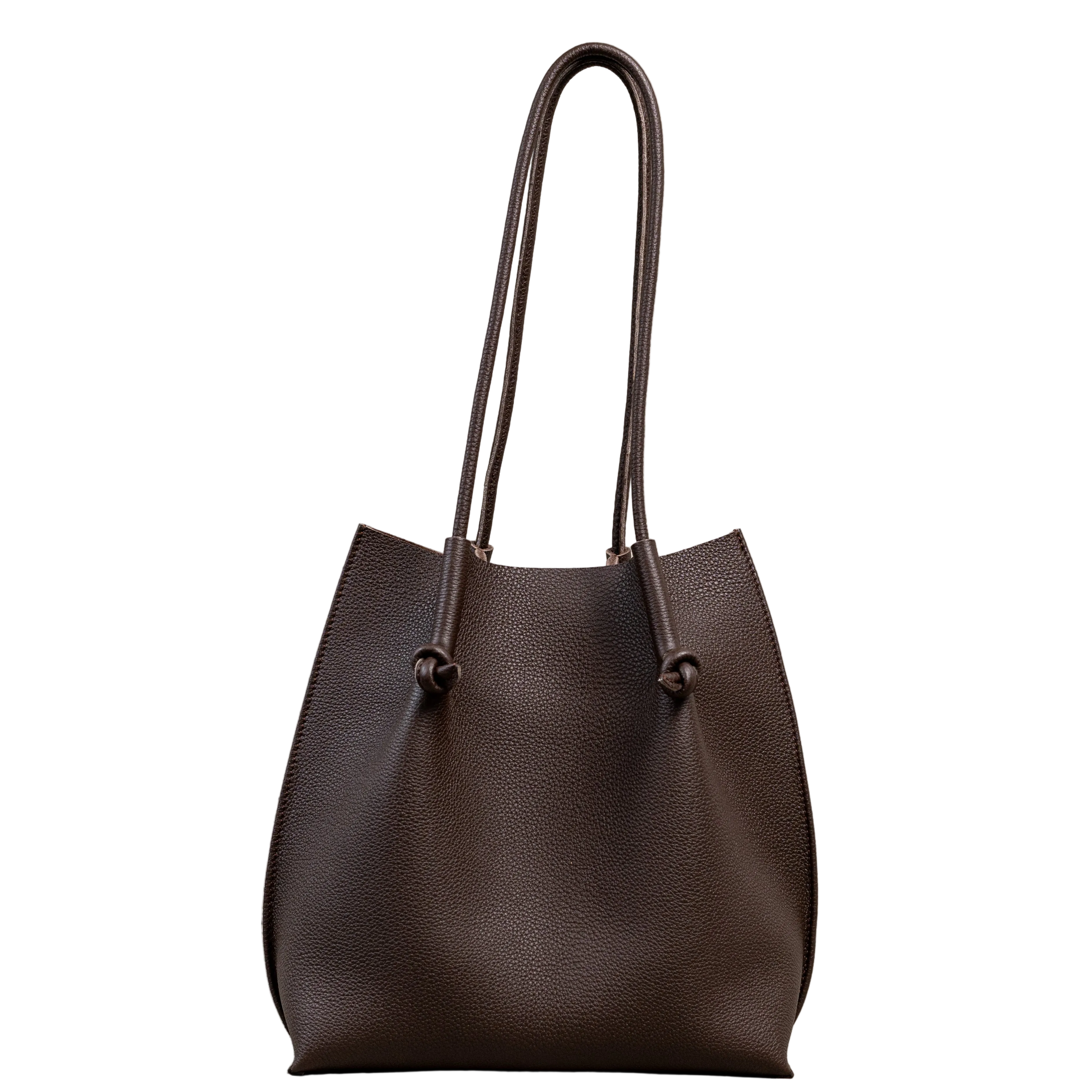 Flora Everyday Leather Tote in Togo Calf Brown, front view on white background. Structured bucket-style tote with tall rolled leather handles and two knotted leather ties cinching the open top.