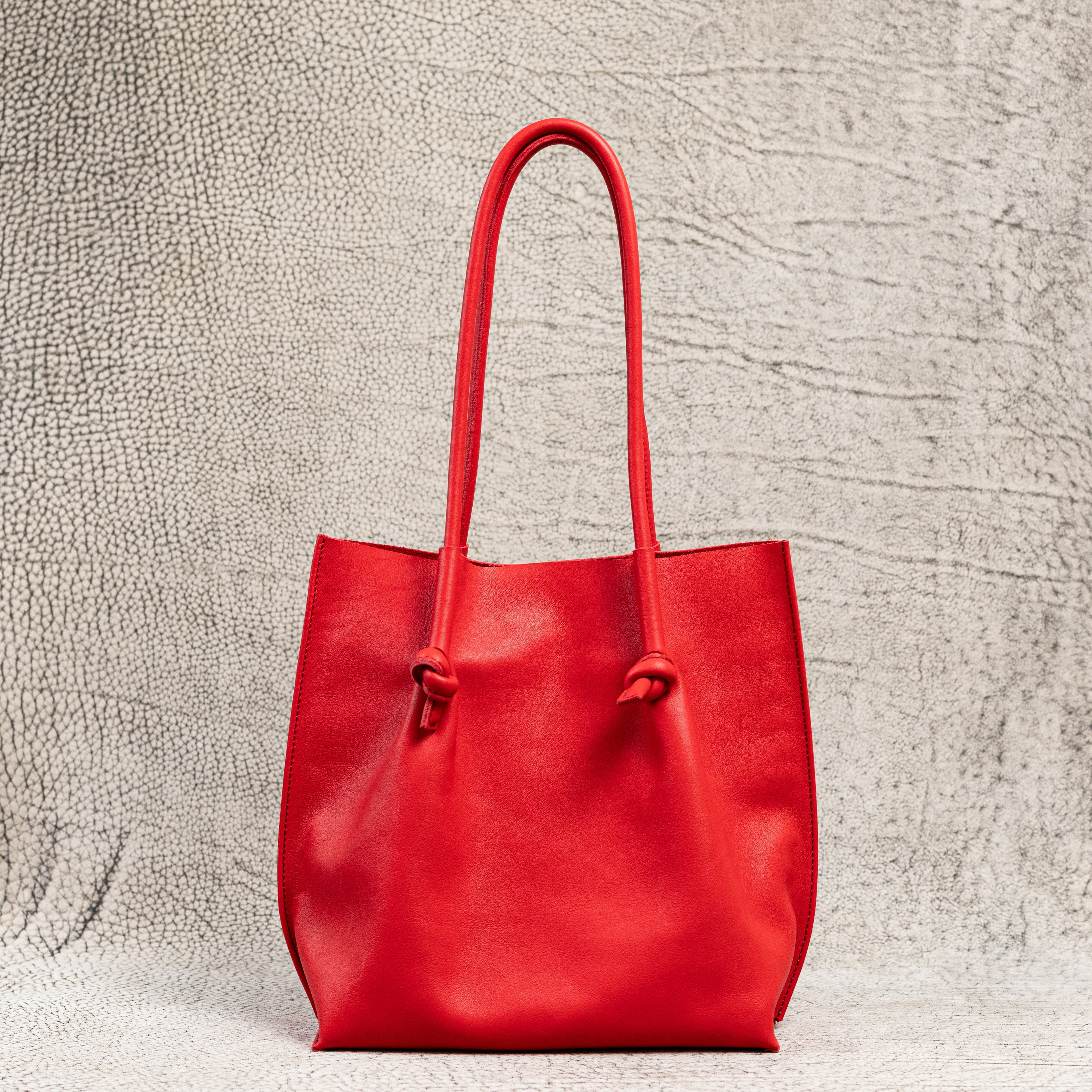 Flora Everyday Leather Tote in Smooth Calf Red with suede interior, rolled handles, and artisan edge details—crafted for bold, everyday elegance.