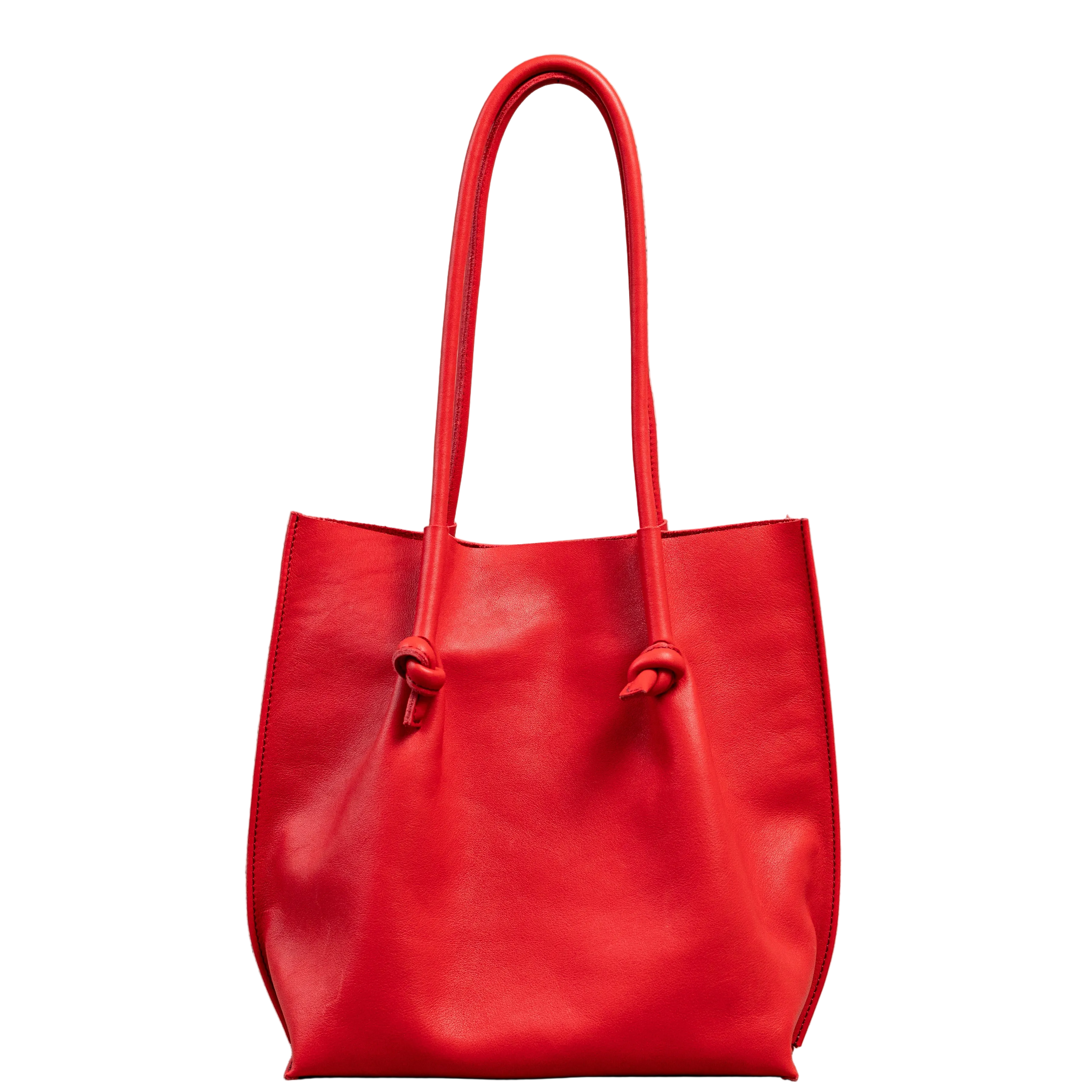 Flora Everyday Tote in Smooth Calf Red stands upright with a soft, fine-grain finish, dual rolled handles, and a single knotted leather closure on each side.