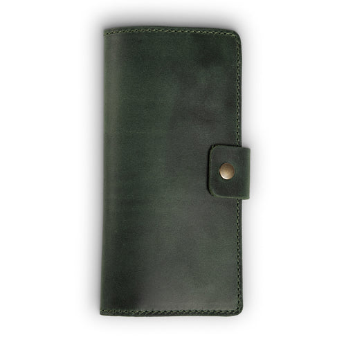Forest green full-grain leather checkbook cover, closed and laid flat. Smooth matte surface with natural character marks, hand-stitched edges in matching green thread, and a small antique brass snap closure tab on the right side.