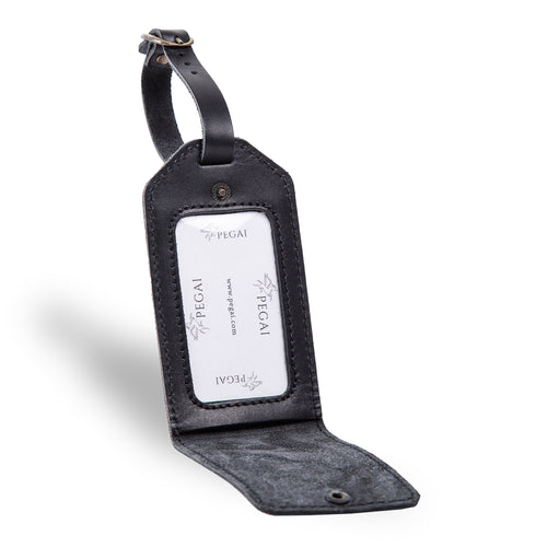 Open black leather luggage tag with clear ID window and suede-lined interior