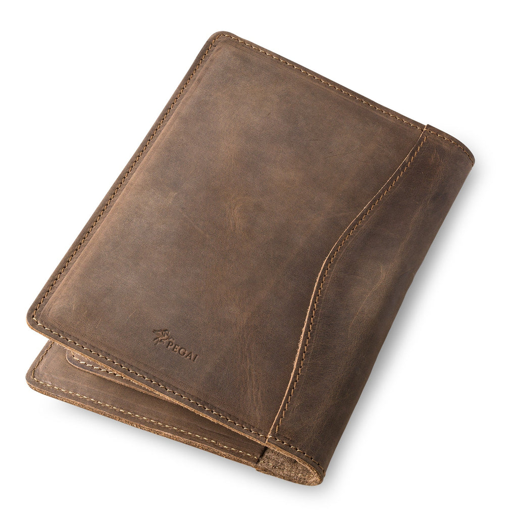 Sand Brown Eriksen padfolio rests closed at an angle, showing the embossed PEGAI winged-horse logo and curved edge stitching detail.