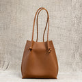Flora Everyday Leather Tote in Togo Calf Taba with suede interior, rolled handles, and hand-finished edges—crafted for everyday function and rustic charm.