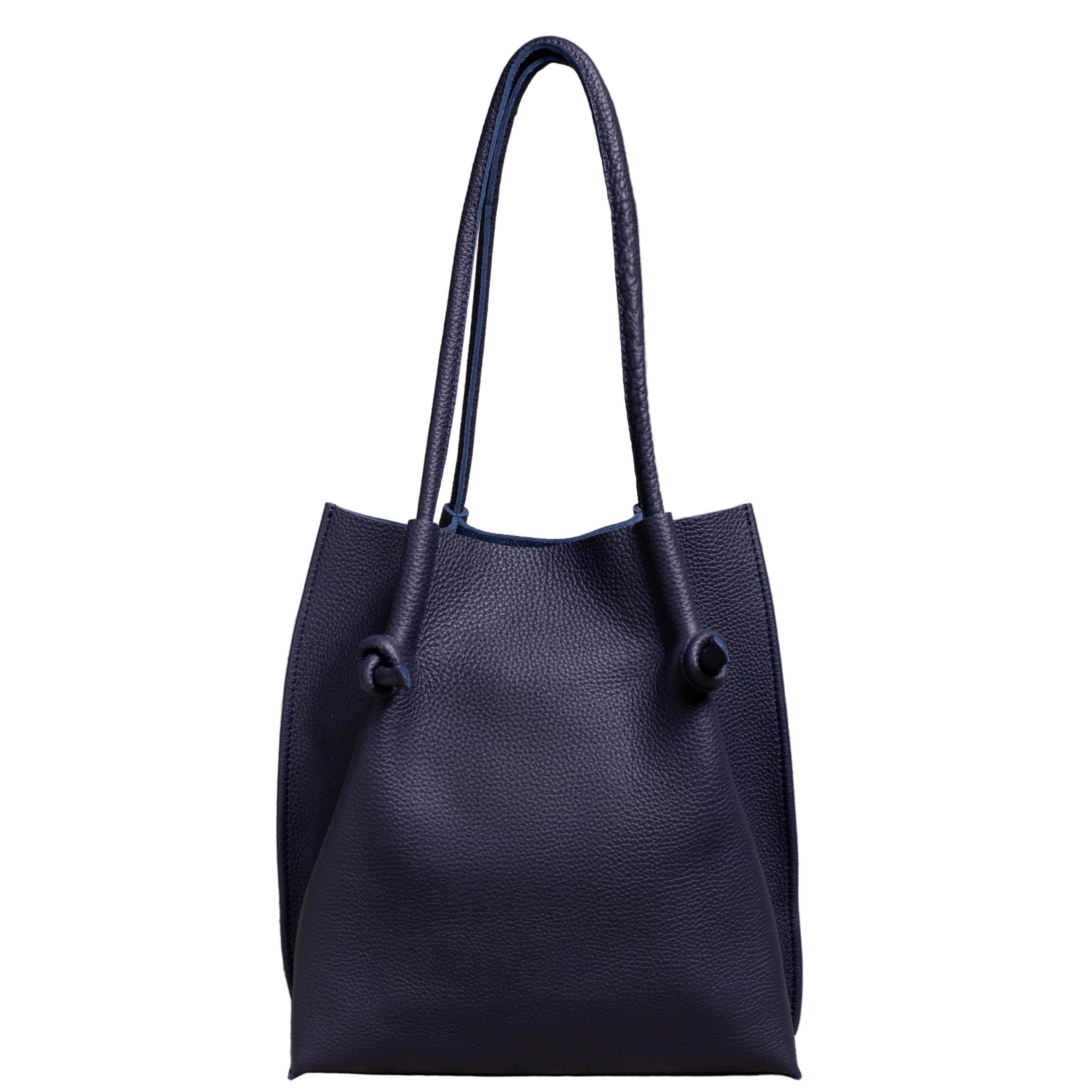 Flora Everyday Leather Tote in Togo Calf Navy Blue, front view on white background. Structured bucket-style tote with tall rolled leather handles and two knotted leather ties cinching the open top.