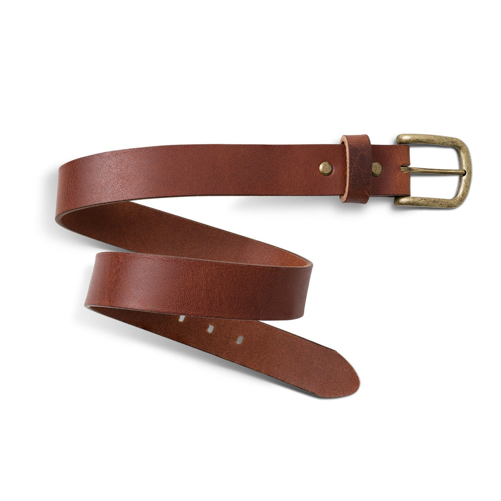 Buffalo Men's Leather Belt in Rustic Brown laid in a loose spiral on a white surface, showing full belt length. Smooth full-grain calfskin surface with warm tonal variation, two antique brass rivets near the buckle end, and a distressed rectangular brass buckle with leather keeper.