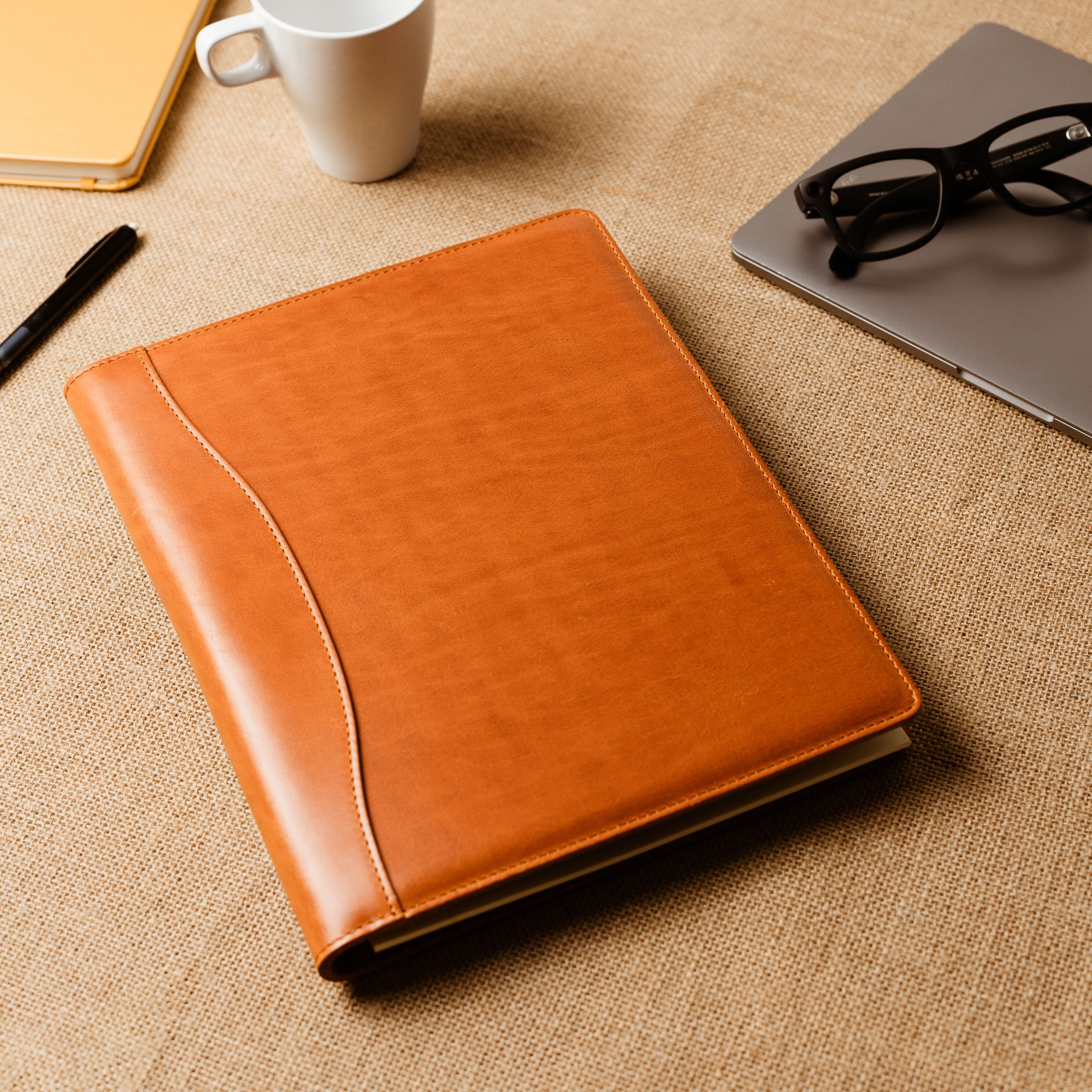Handcrafted leather padfolio in Whiskey Cognac with pen holder, card pocket, and folder slot—designed by Tanner Leatherstein for legal pads.