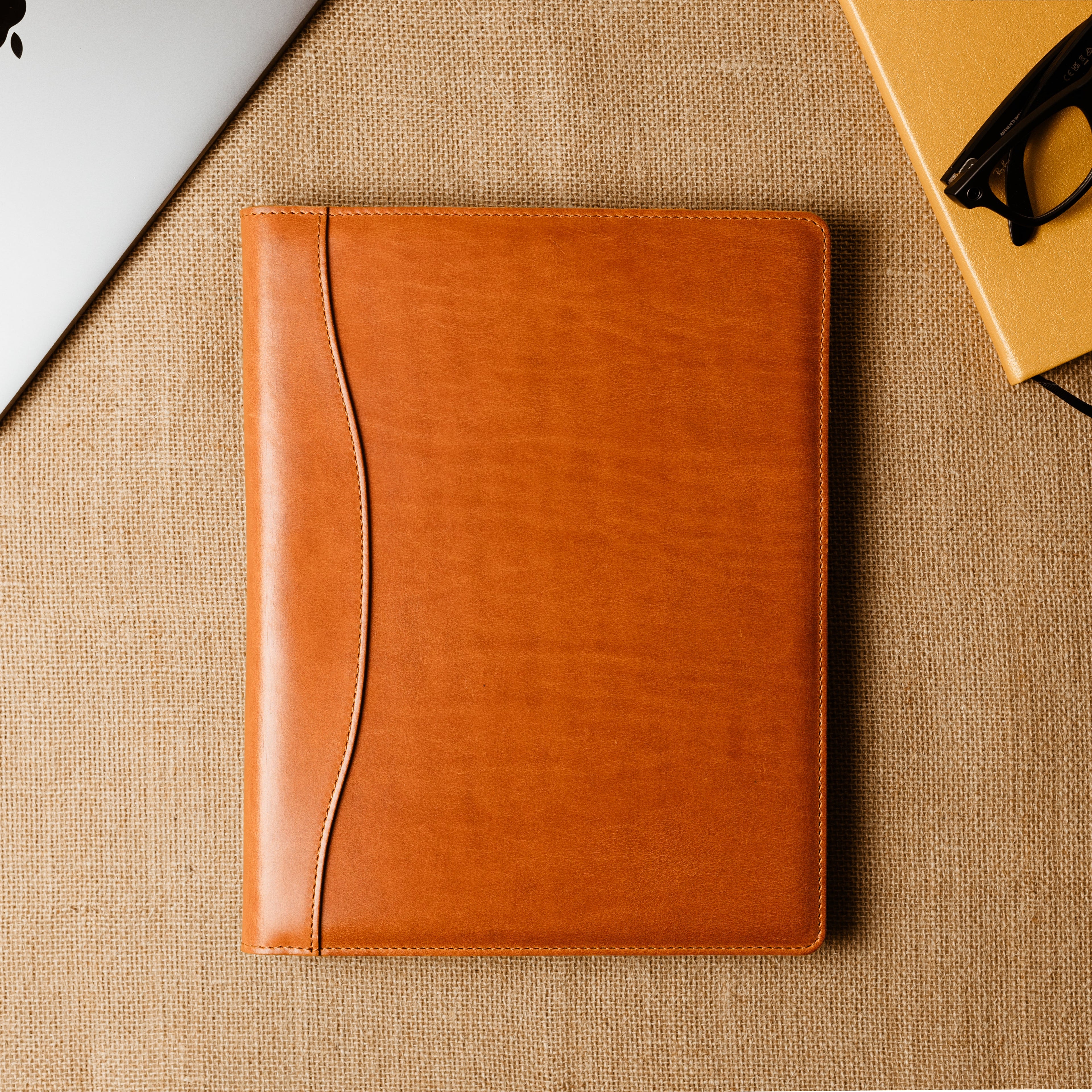 Handcrafted leather padfolio in Whiskey Cognac with pen holder, card pocket, and folder slot—designed by Tanner Leatherstein for legal pads.